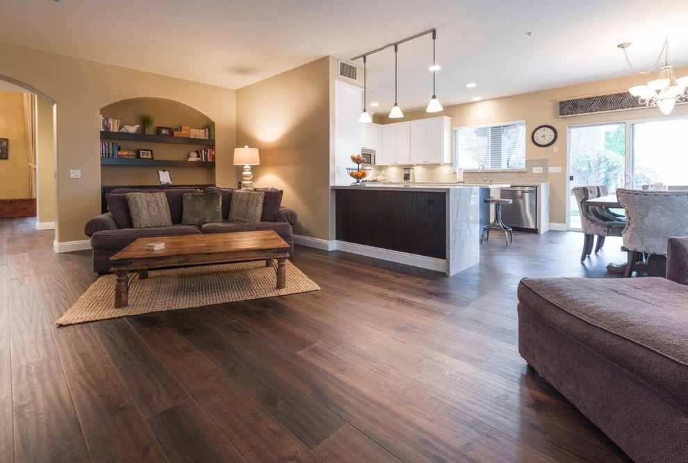 Inspiration for a large contemporary open plan games room in San Diego with beige walls and medium hardwood flooring.