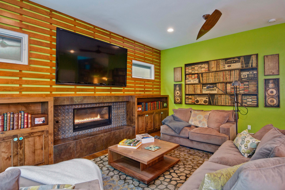 Photo of a contemporary games room in San Diego with green walls, medium hardwood flooring and a wall mounted tv.