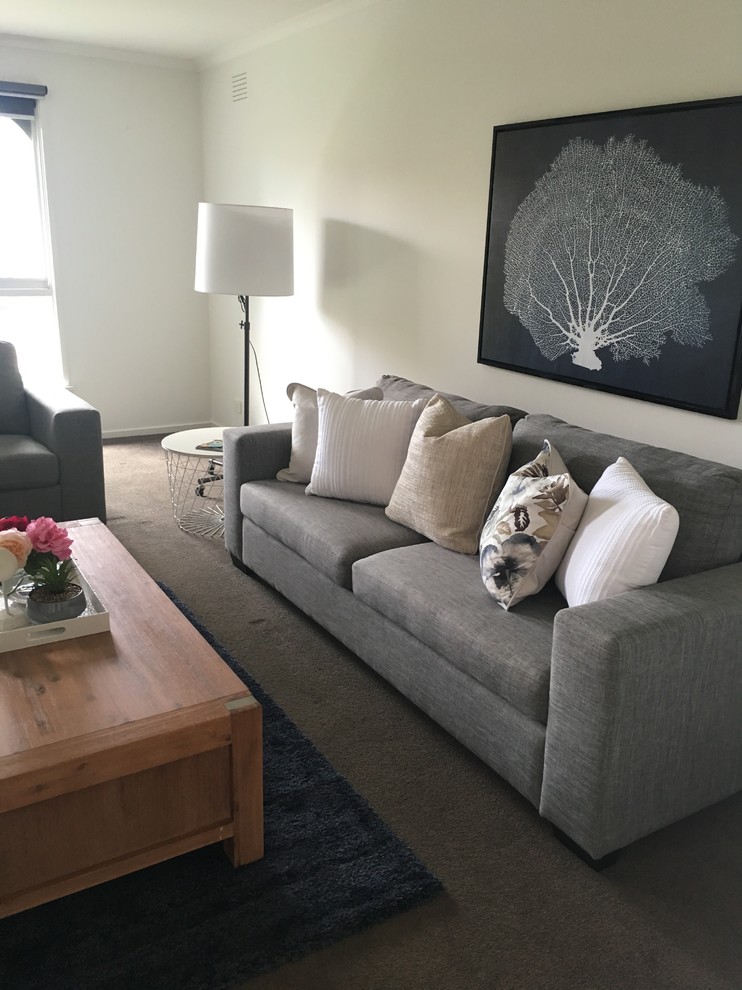 Foto di un soggiorno design di medie dimensioni e aperto con moquette, nessuna TV e pavimento grigio