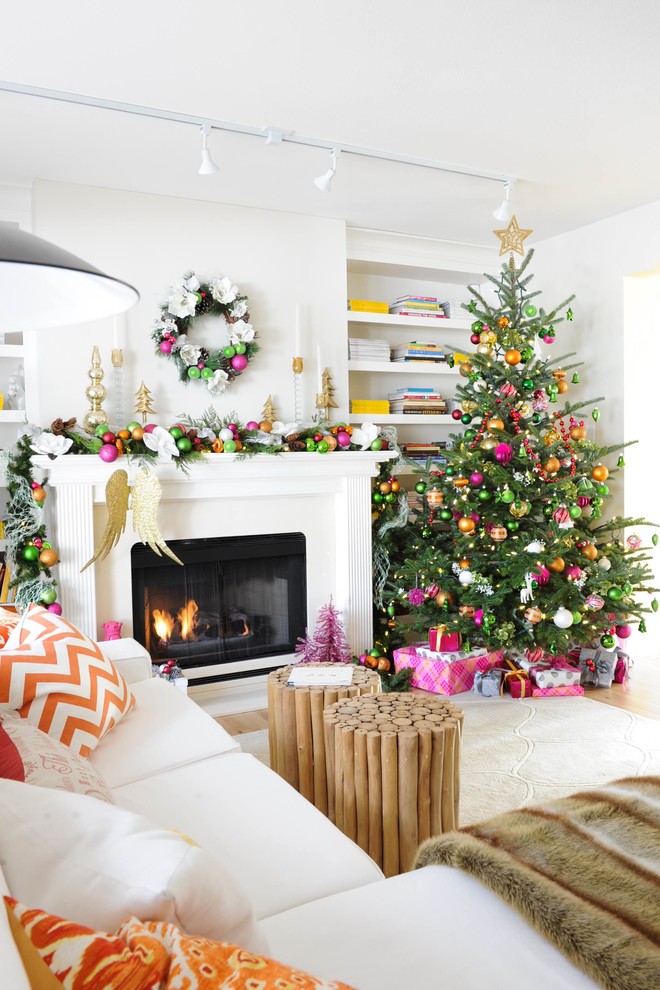 Inspiration for a mid-sized transitional enclosed light wood floor family room remodel in Vancouver with white walls and a standard fireplace