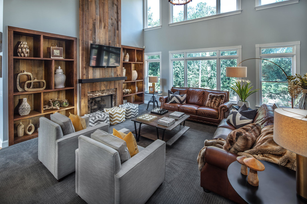 Large mountain style open concept carpeted, gray floor and wood wall family room photo in Atlanta with gray walls, a standard fireplace, a media wall and a stone fireplace