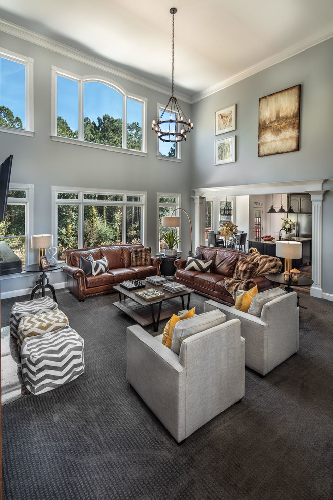 Example of a large mountain style open concept carpeted, gray floor and wood wall family room design in Atlanta with gray walls, a standard fireplace, a media wall and a stone fireplace