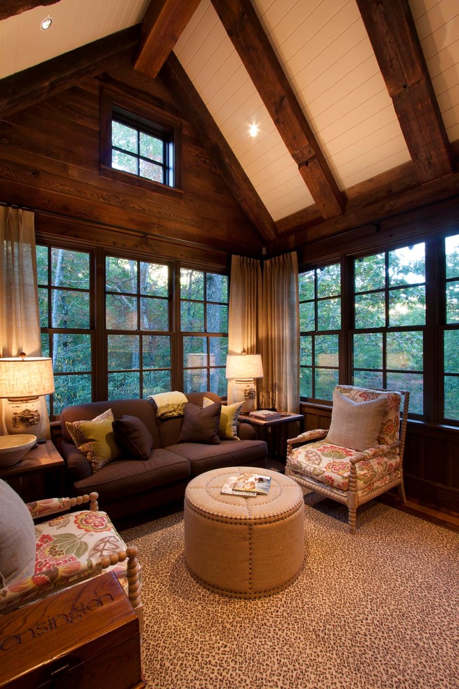 Family room - rustic family room idea in Other with brown walls