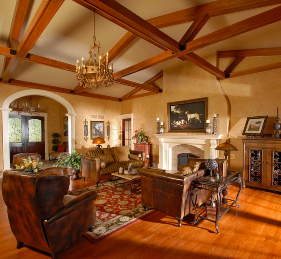 This is an example of a medium sized rustic open plan games room in New York with beige walls, medium hardwood flooring, a standard fireplace, a plastered fireplace surround and no tv.