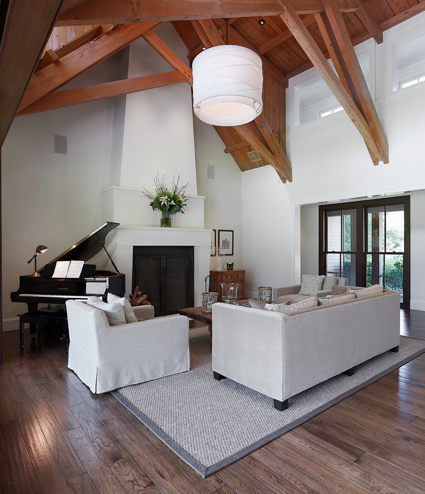 Inspiration for a classic open plan games room in San Francisco with a music area, white walls, dark hardwood flooring, a standard fireplace, no tv and a plastered fireplace surround.