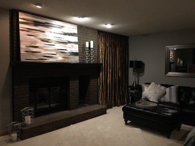Mid-sized trendy open concept carpeted and beige floor family room photo in Boston with gray walls, a standard fireplace, a brick fireplace and a tv stand