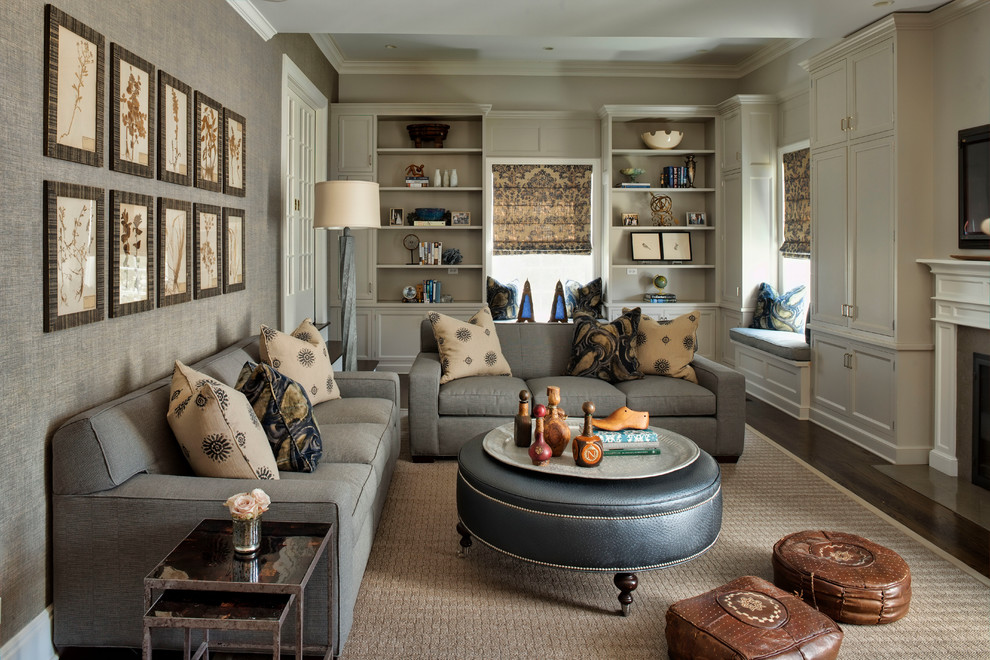 Inspiration for a large timeless enclosed dark wood floor family room remodel in Chicago with gray walls, a standard fireplace and a wall-mounted tv