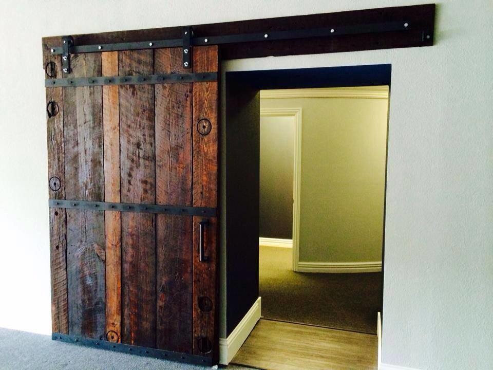 Restored farmhouse door with original antique pocket door sliders