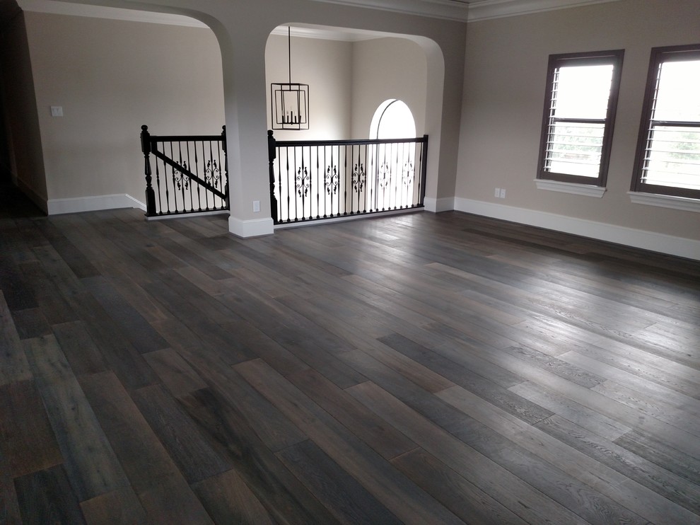 Photo of a large mediterranean open plan games room in Houston with a game room, beige walls and dark hardwood flooring.
