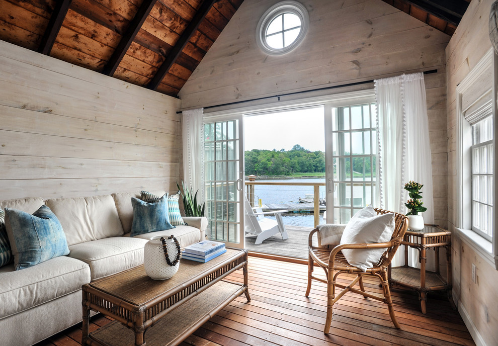 Example of a beach style family room design in Other