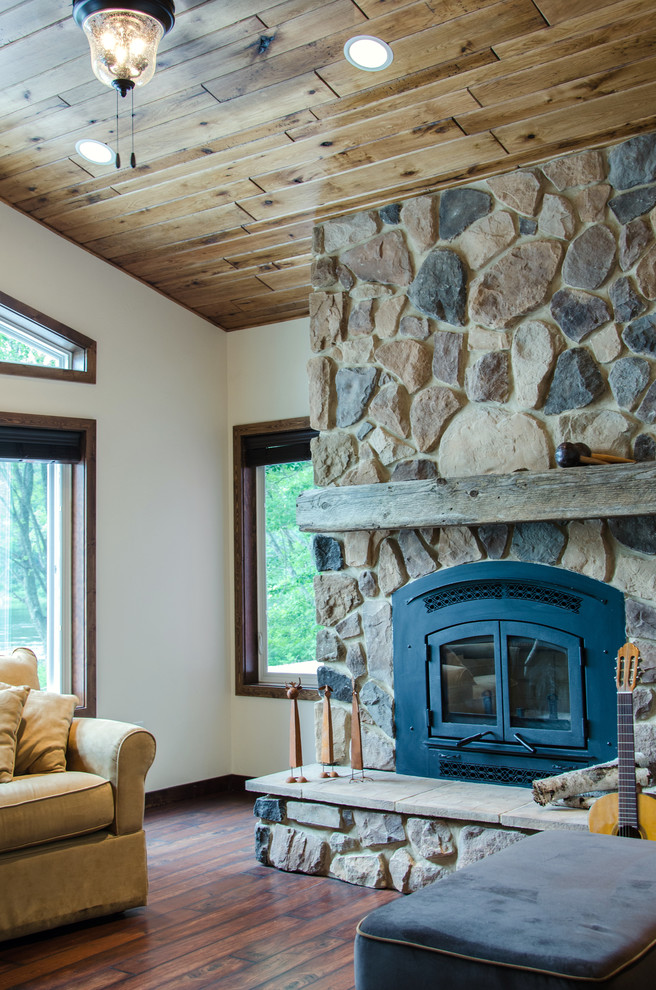 Mid-sized mountain style open concept linoleum floor family room photo in Boston with white walls, a standard fireplace and a stone fireplace