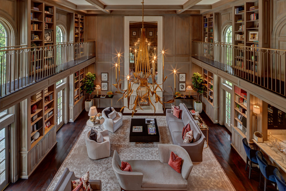 Inspiration for an expansive traditional mezzanine games room in Houston with a reading nook, brown walls, dark hardwood flooring, a standard fireplace and brown floors.