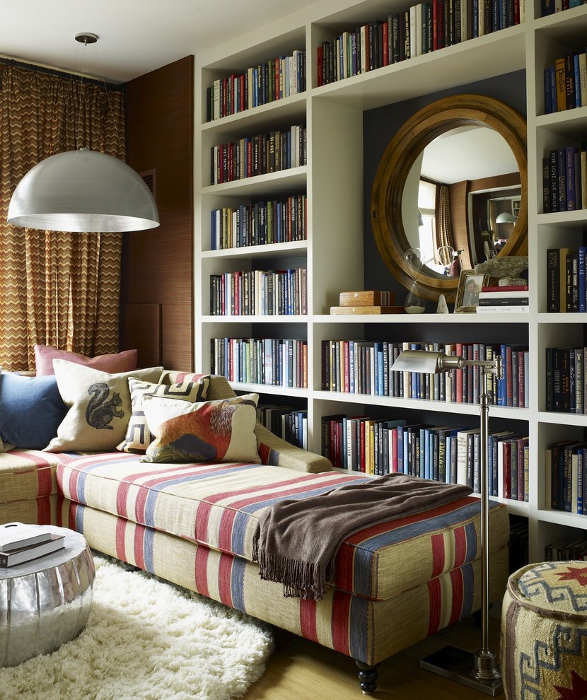Eclectic family room library photo in New York