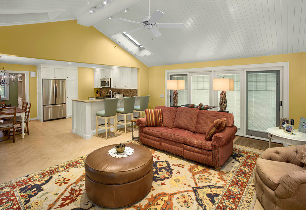 Mid-sized elegant open concept light wood floor family room photo in Other with yellow walls