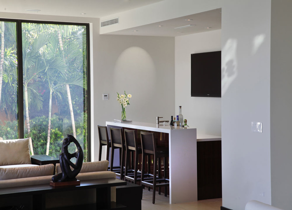 Inspiration for a large contemporary open concept family room remodel in Miami with a bar, white walls and a wall-mounted tv