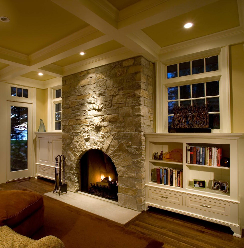 Elegant family room photo in Minneapolis with a stone fireplace