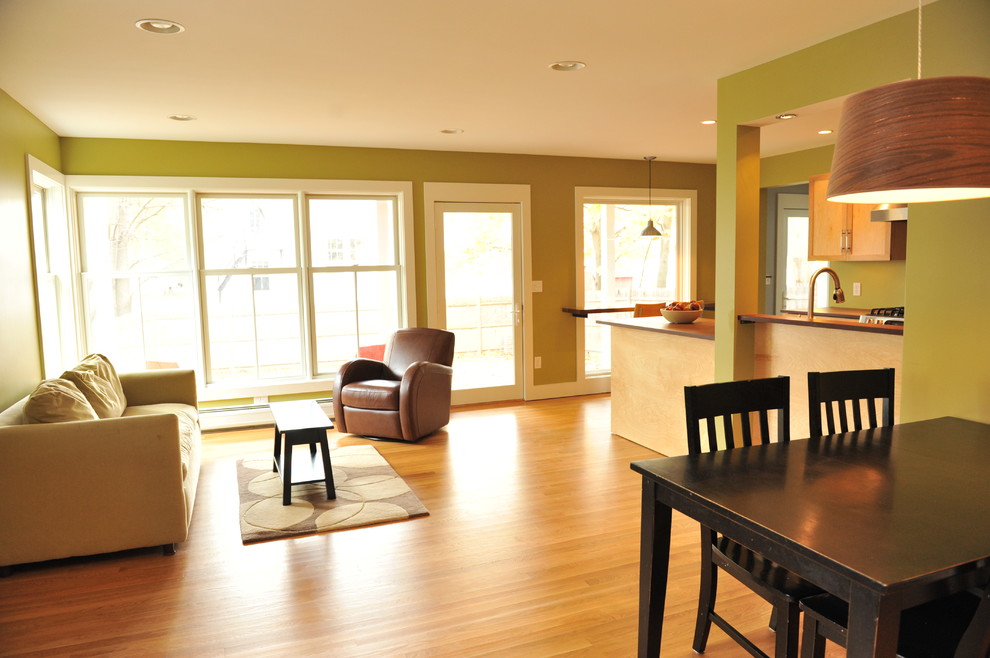 Photo of a contemporary open plan games room in Portland Maine with green walls and medium hardwood flooring.