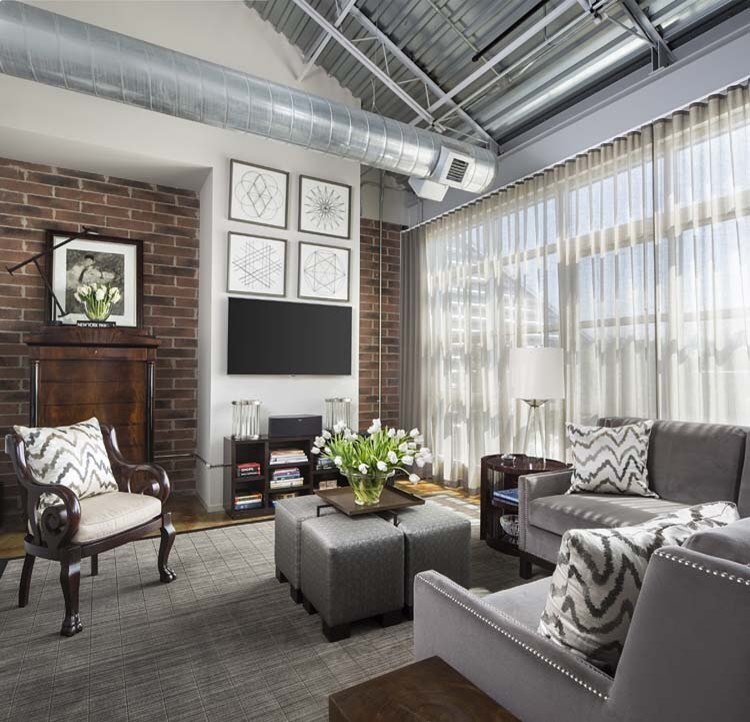 Mid-sized urban open concept carpeted and gray floor family room photo in Detroit with white walls, no fireplace and a wall-mounted tv