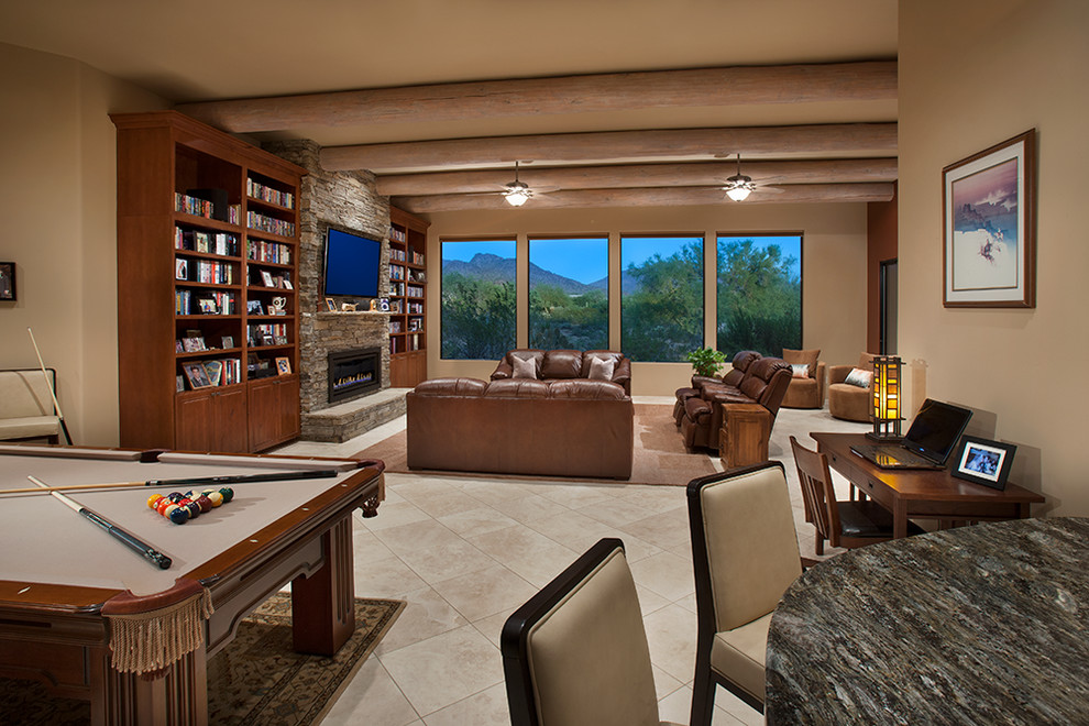 Inspiration for a large rustic open plan games room in Phoenix with a game room, beige walls, a standard fireplace, a stone fireplace surround, a wall mounted tv and porcelain flooring.