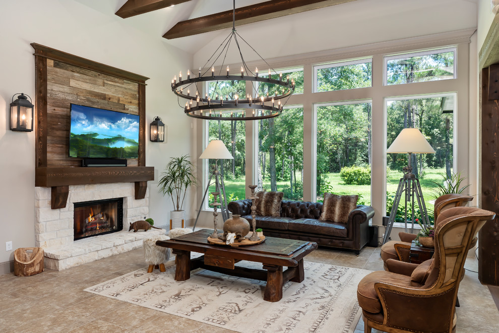 Mountain style open concept beige floor family room photo in Houston with a stone fireplace, a wall-mounted tv, white walls and a ribbon fireplace