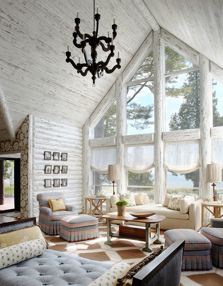Example of a beach style open concept family room design in Milwaukee with white walls and no tv