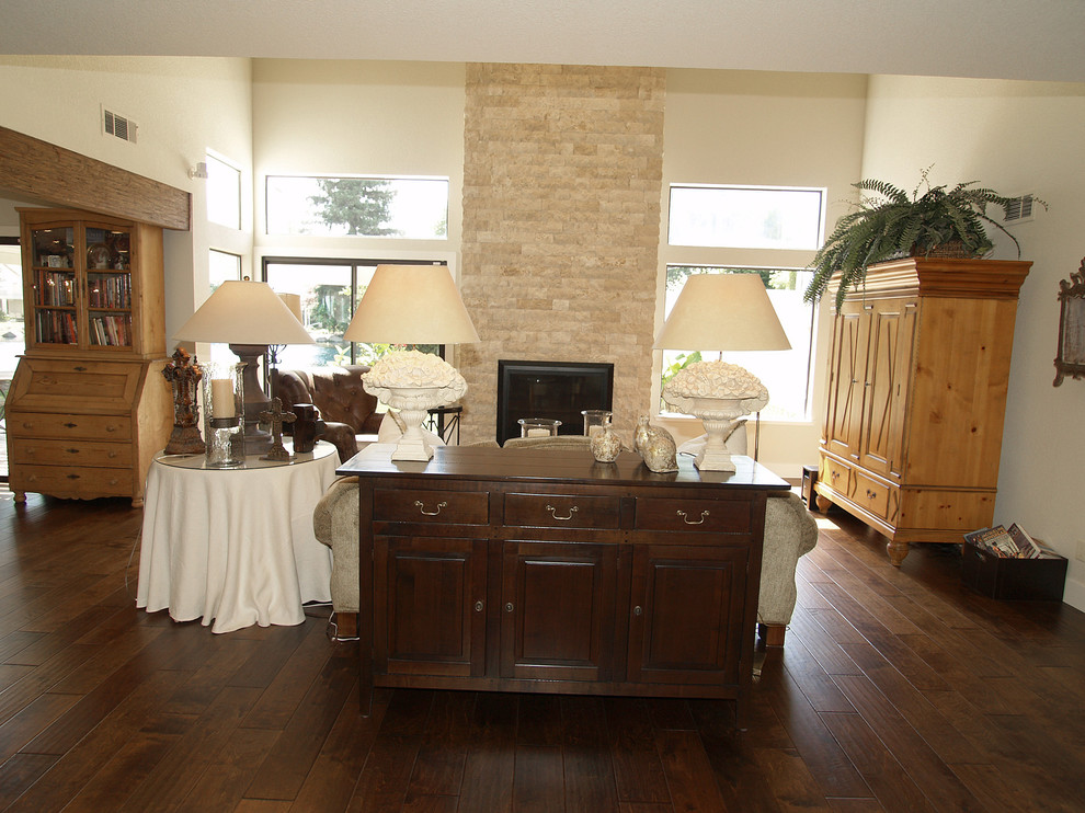 Photo of a medium sized rustic open plan games room in Sacramento with white walls, medium hardwood flooring, a standard fireplace and a stone fireplace surround.