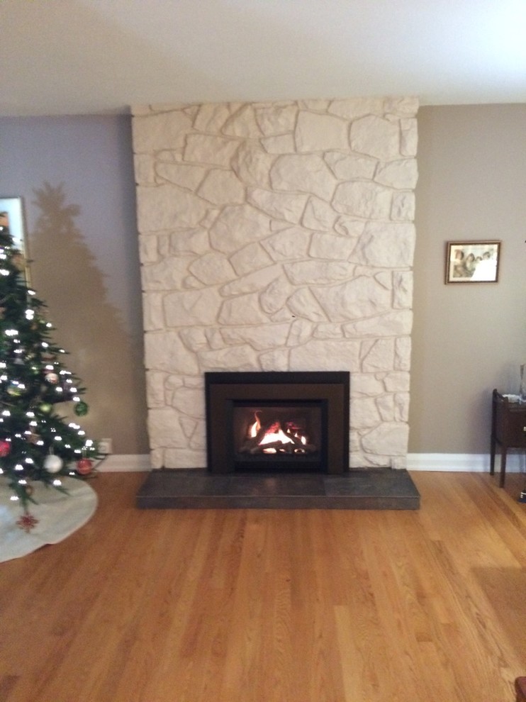 Rustic stone fireplace surround Farmhouse Family Room Ottawa by