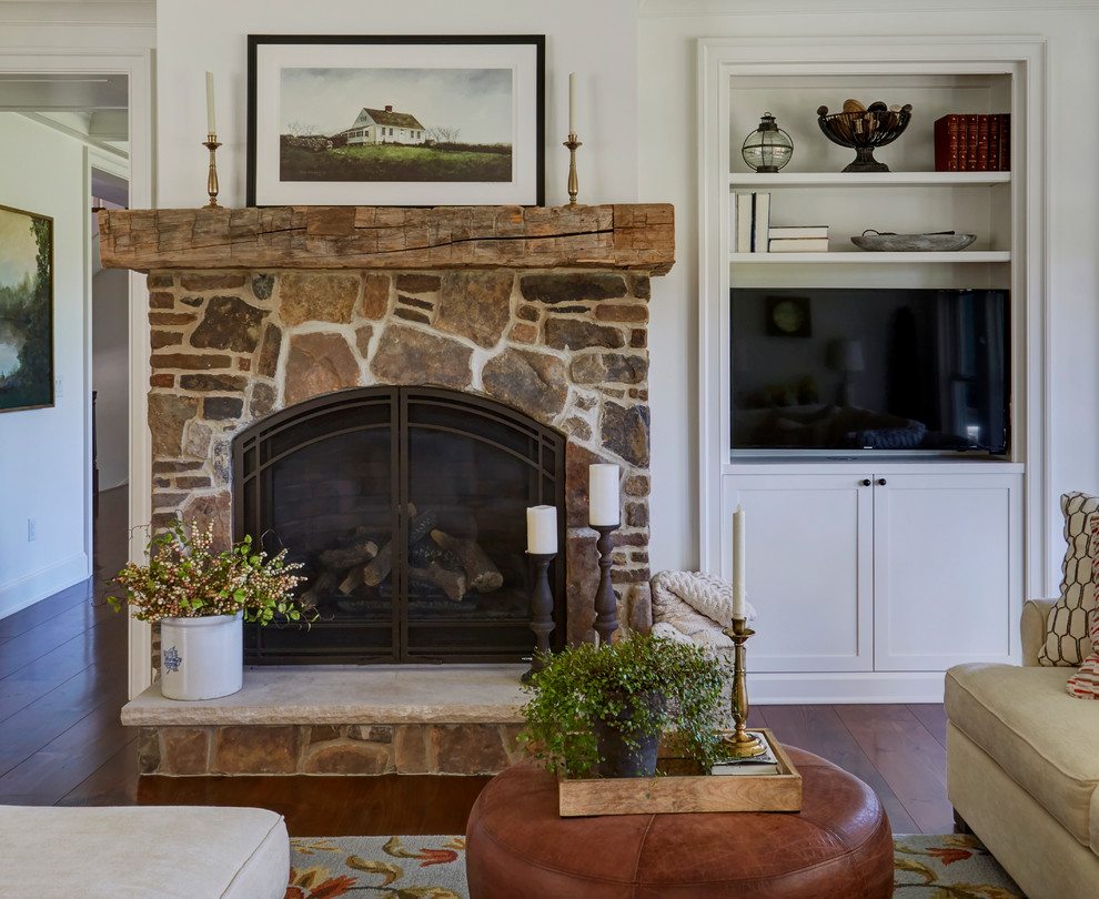 Inspiration for a large cottage open concept dark wood floor and brown floor family room remodel in Chicago with white walls, a standard fireplace, a stone fireplace and a media wall