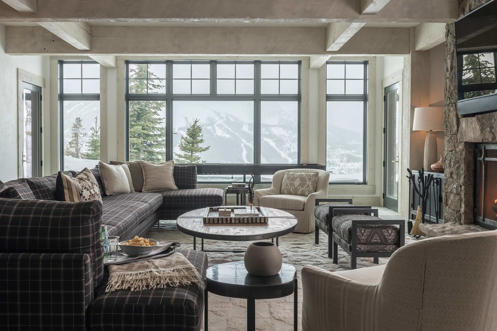 Inspiration for a rustic family room remodel in Other with a standard fireplace and a wall-mounted tv