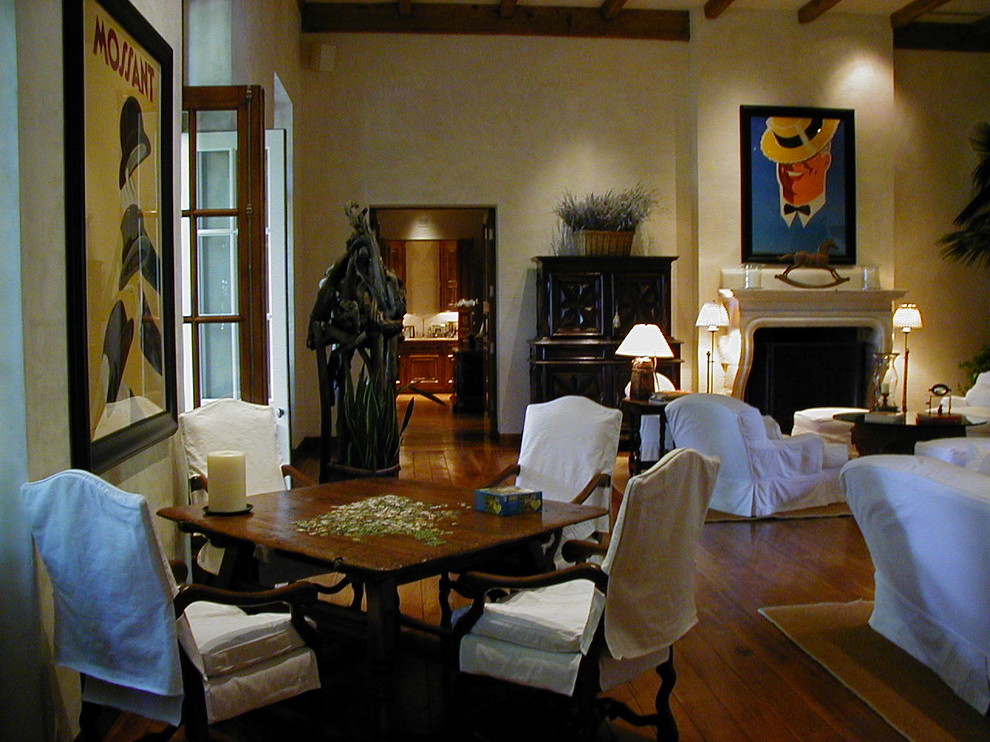 Example of a large classic open concept dark wood floor and brown floor family room design in San Francisco with beige walls, a standard fireplace, a stone fireplace and no tv