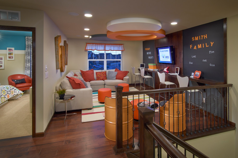 Inspiration for a contemporary family room remodel in Denver with green walls