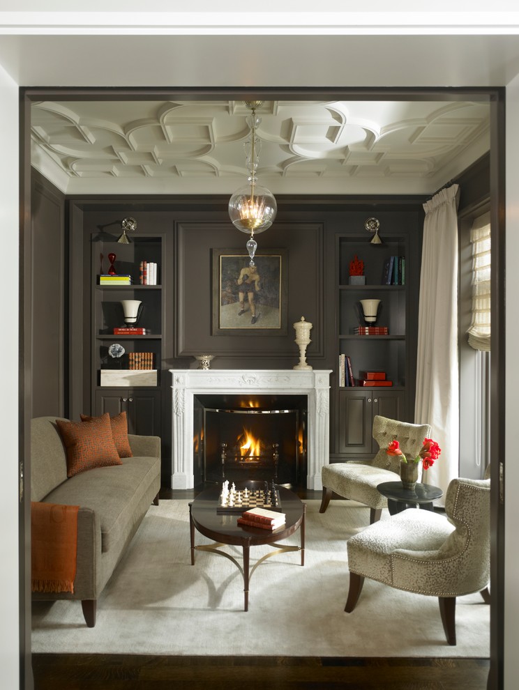 Example of a classic enclosed family room design in Chicago with a standard fireplace and gray walls