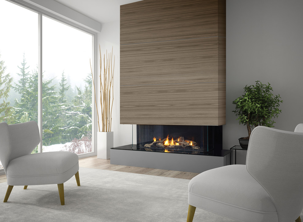 Idée de décoration pour une grande salle de séjour minimaliste ouverte avec un mur gris, un sol en bois brun, une cheminée standard, un manteau de cheminée en bois et aucun téléviseur.