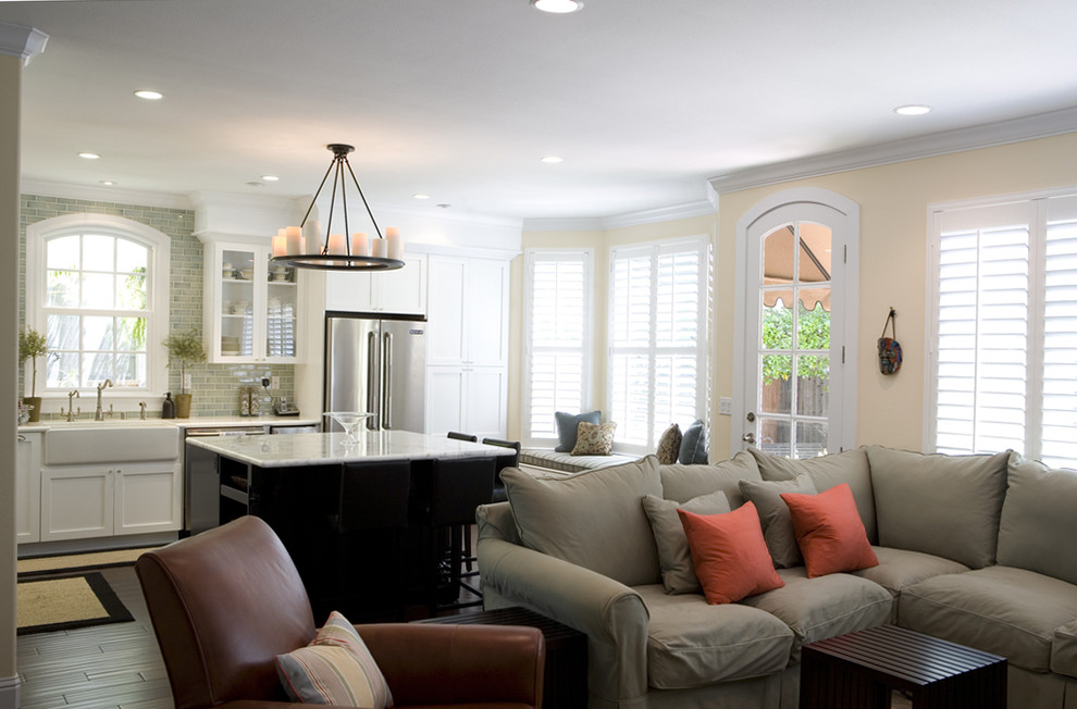 Elegant open concept family room photo in San Francisco with yellow walls and no fireplace