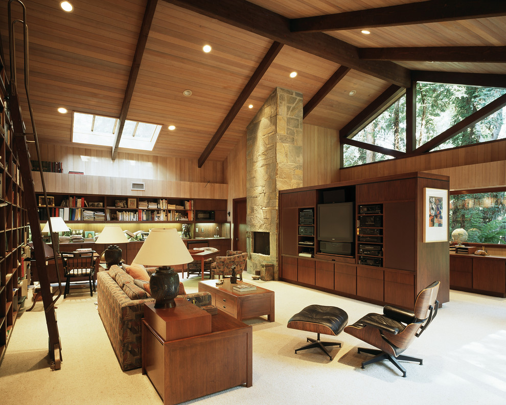 Foto di un soggiorno contemporaneo aperto con libreria, moquette, parete attrezzata e tappeto
