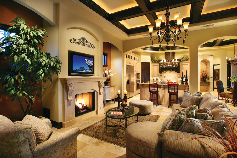 Large tuscan open concept travertine floor family room photo in Miami with multicolored walls, a standard fireplace, a stone fireplace and a media wall