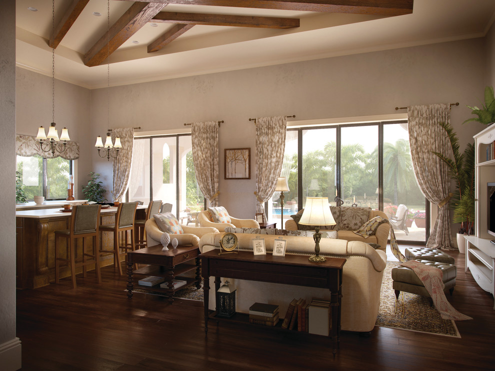 Modelo de sala de estar abierta mediterránea grande sin chimenea con paredes grises, suelo de madera oscura y pared multimedia