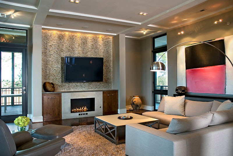 Photo of a large contemporary open plan games room in Other with grey walls, dark hardwood flooring, a ribbon fireplace, a stone fireplace surround and a wall mounted tv.