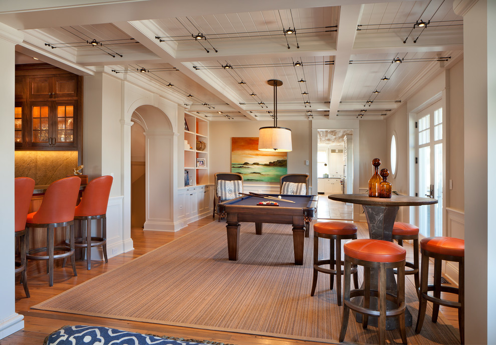 This is an example of a large coastal open plan games room in New York with a game room, beige walls, medium hardwood flooring and brown floors.
