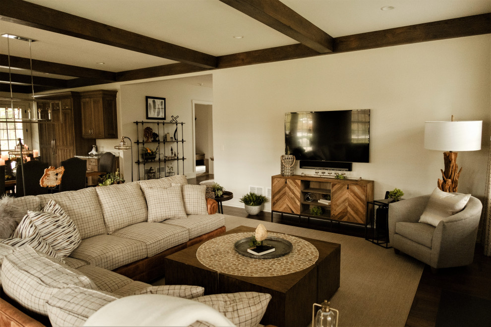 Large country open concept medium tone wood floor and brown floor family room photo in Chicago with beige walls and a wall-mounted tv