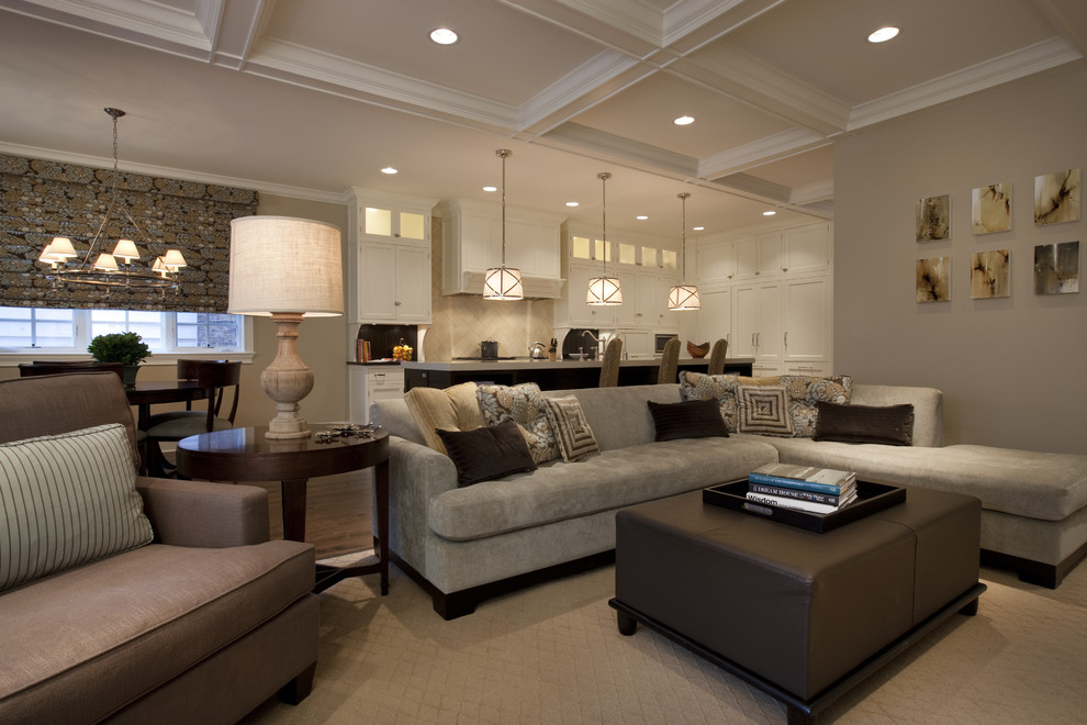 Elegant open concept dark wood floor family room photo in Chicago with beige walls