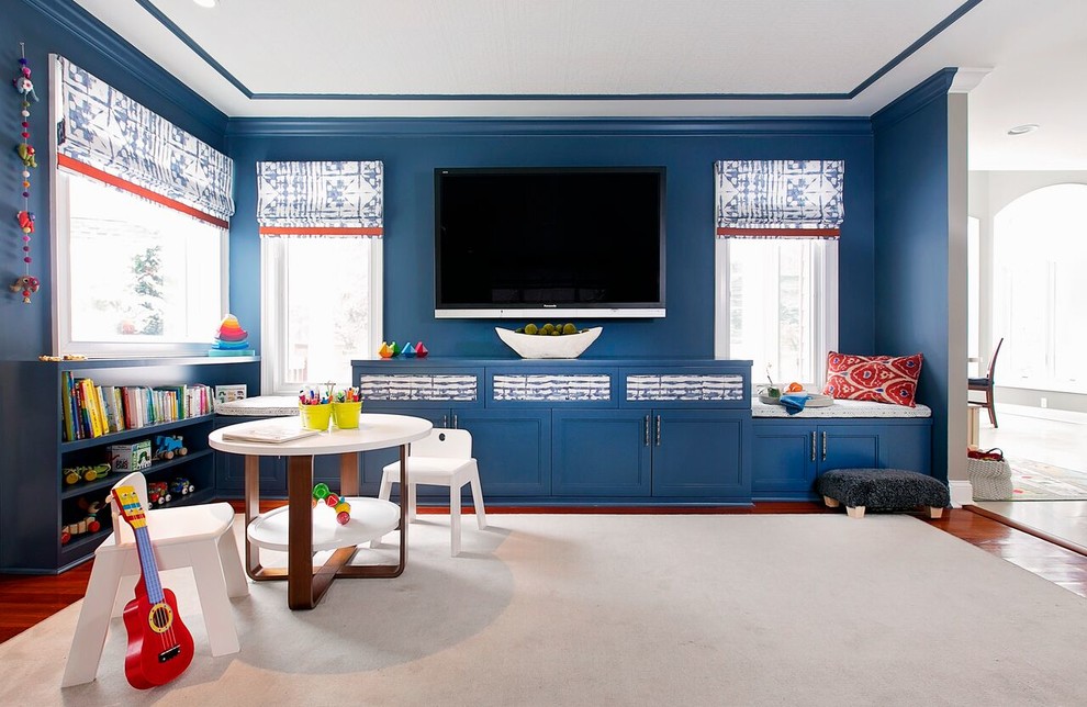 Inspiration for a mid-sized modern enclosed carpeted family room remodel in New York with blue walls, a standard fireplace, a stone fireplace and a wall-mounted tv