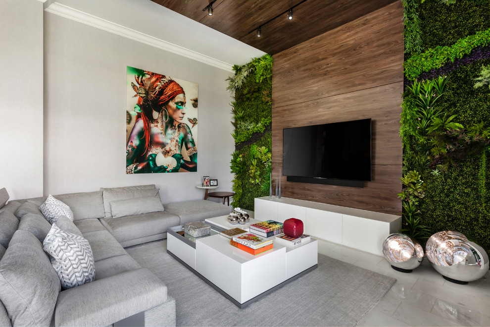 Family room - contemporary gray floor family room idea in Miami with white walls and a wall-mounted tv