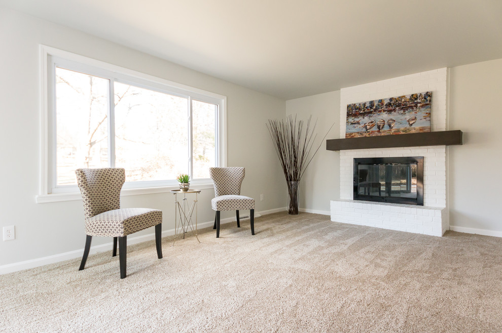 Design ideas for a medium sized traditional enclosed games room in Cincinnati with grey walls, carpet, a standard fireplace and a brick fireplace surround.