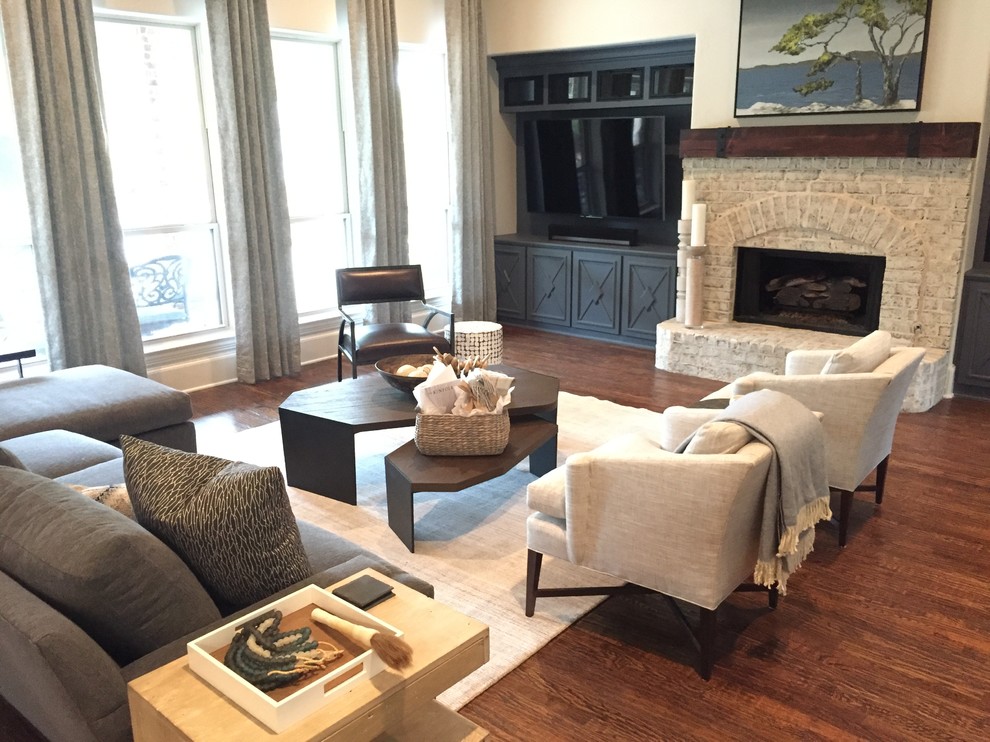 Photo of a large scandi open plan games room in Dallas with white walls, dark hardwood flooring, a standard fireplace, a brick fireplace surround, a built-in media unit and brown floors.