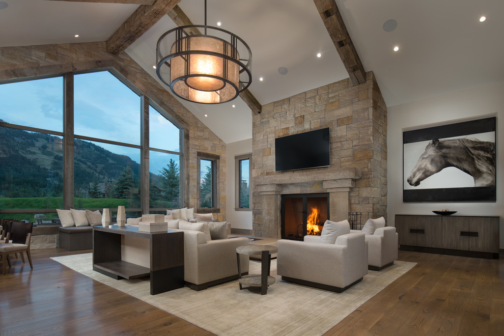Family room - rustic family room idea in Other with a standard fireplace and a stone fireplace