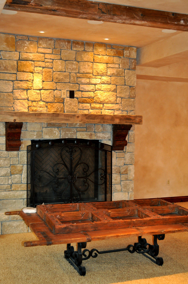 Example of a tuscan family room design in Kansas City