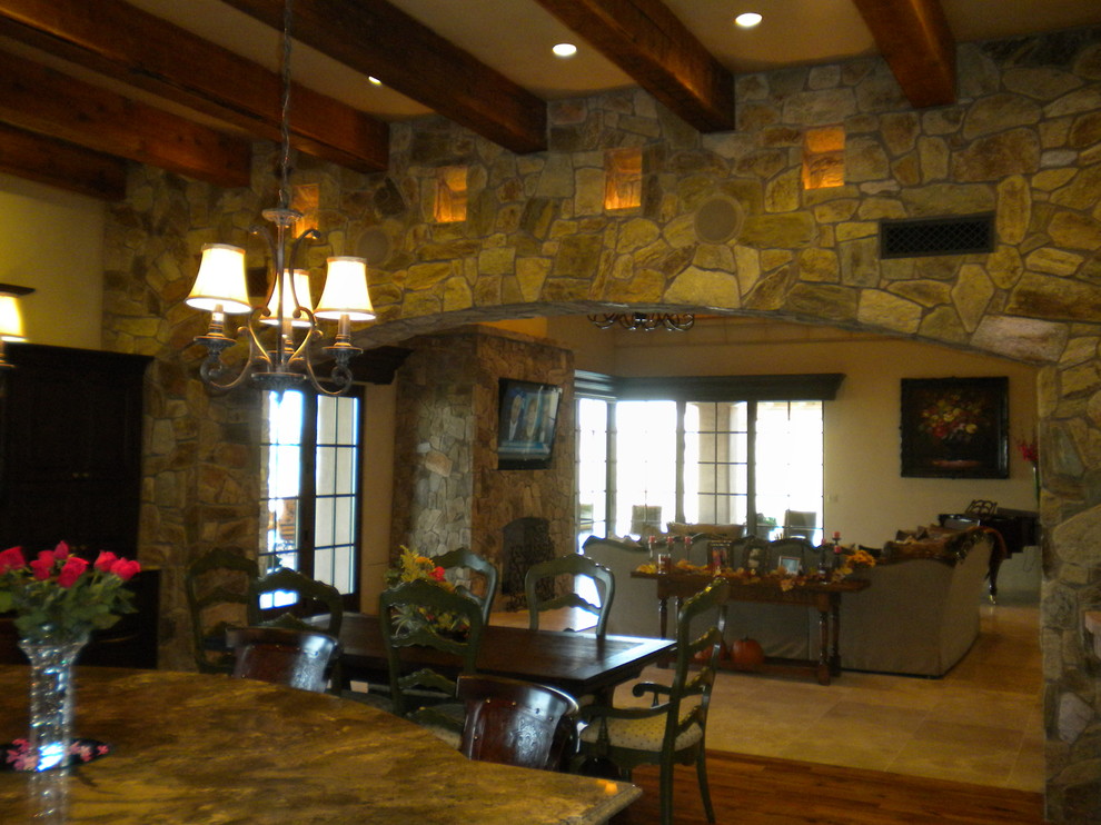 Example of a tuscan family room design in Phoenix
