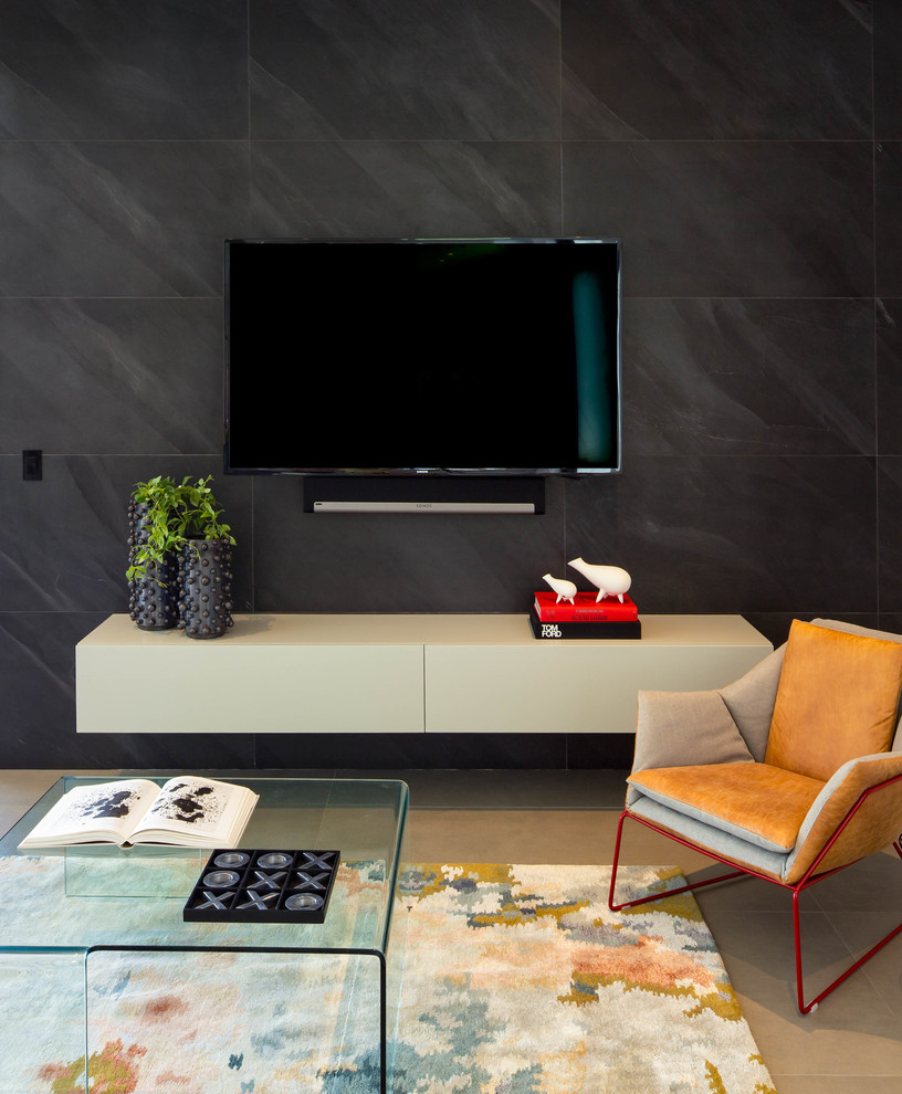 Inspiration for a small contemporary open concept porcelain tile and gray floor family room remodel in Miami with black walls and a wall-mounted tv