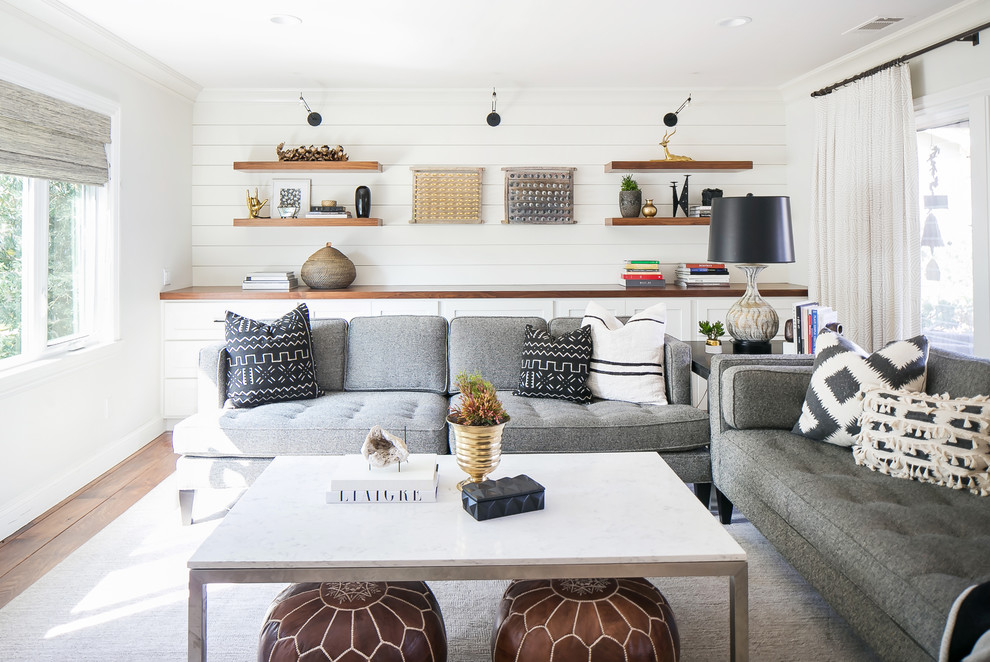 Rural games room in Orange County with white walls, dark hardwood flooring and brown floors.